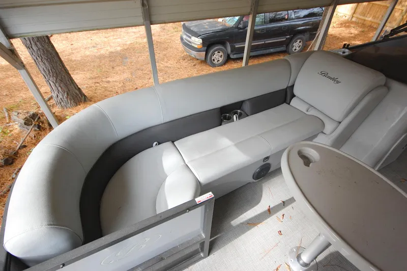 Slide: The Image of 2021 Bentley Pontoons 243 Swingback interior seating area. - 9
