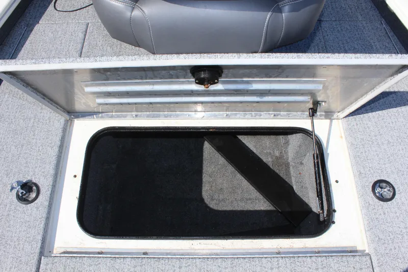Slide: The Image of Open storage compartment on a 2021 Tracker 195 TXW Tournament Edition boat. - 22