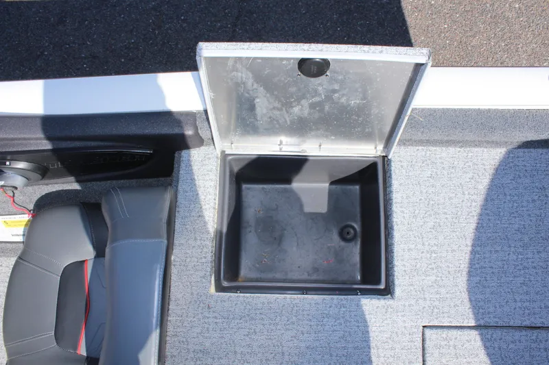 Slide: The Image of 2021 Tracker 195 TXW Tournament Edition storage compartment with open lid. - 11
