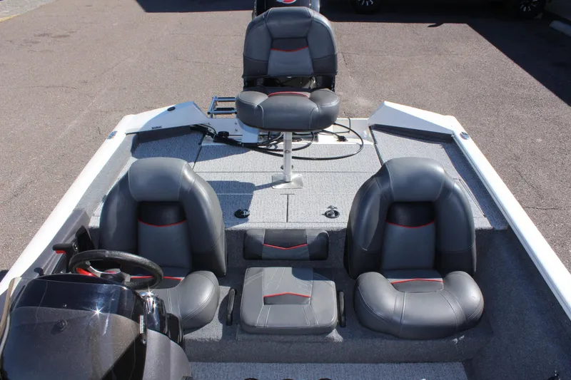 Slide: The Image of 2021 Tracker 195 TXW Tournament Edition boat interior with seating and steering wheel. - 12