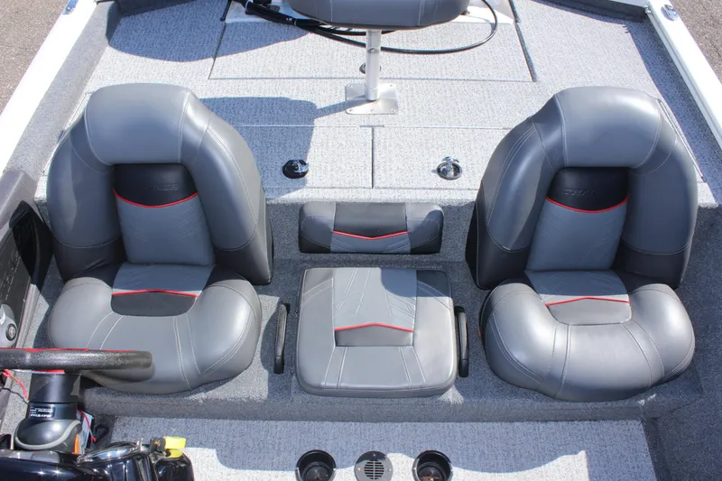 Slide: The Image of 2021 Tracker 195 TXW Tournament Edition boat interior with gray and black seats. - 13