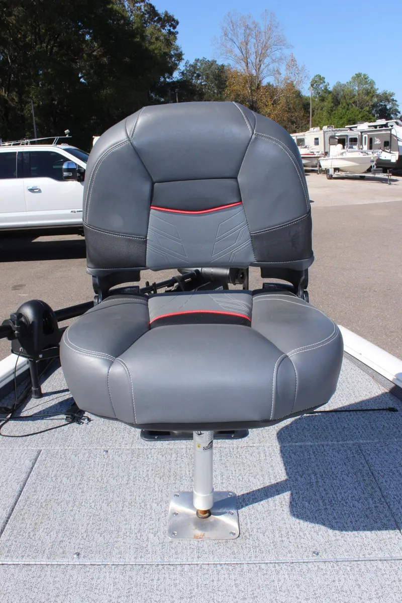 Slide: The Image of 2021 Tracker 195 TXW Tournament Edition boat seat in a parking lot. - 26