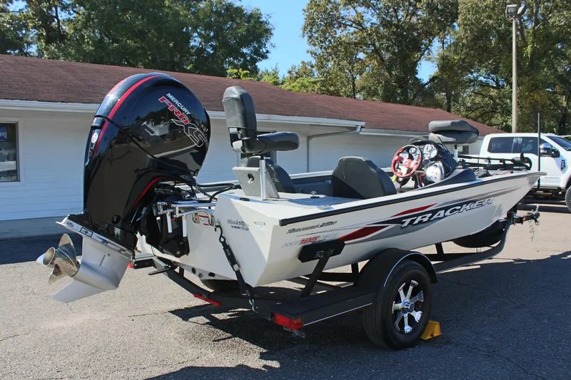 Slide: The Image of 2021 Tracker 195 TXW Tournament Edition fishing boat with outboard motor. - 5