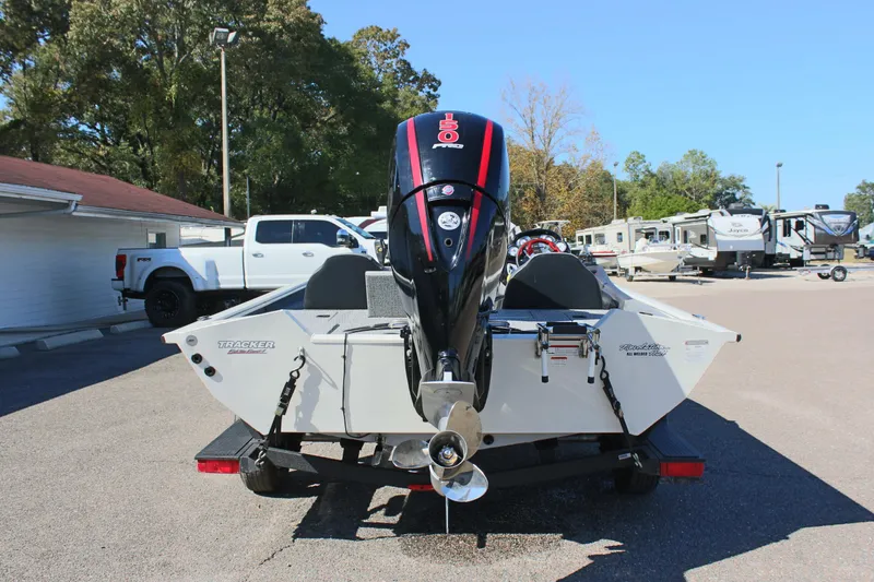 Slide: The Image of 2021 Tracker 195 TXW Tournament Edition boat rear view with outboard motor. - 6