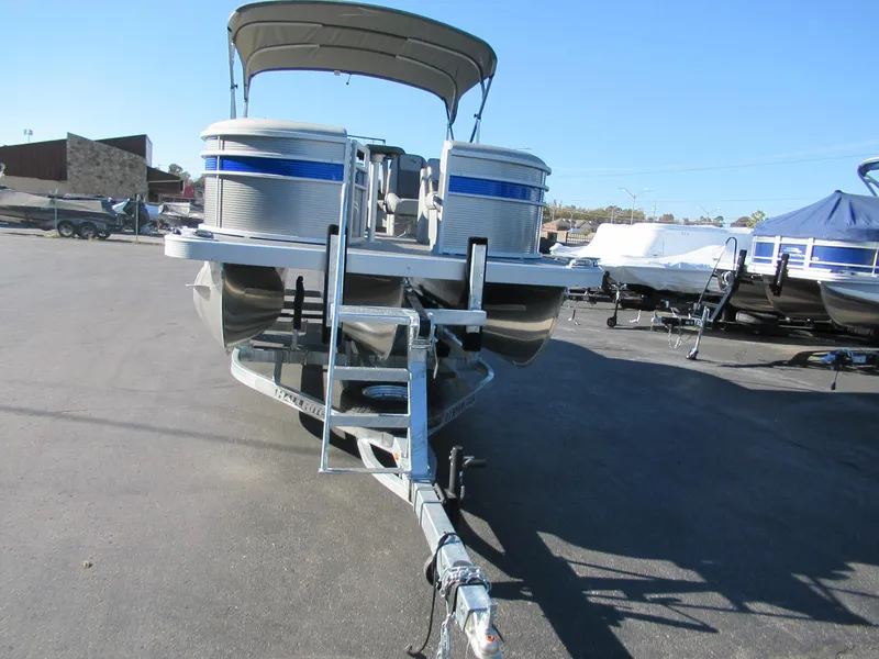 Slide: The Image of 2024 Bennington 22 SXSR pontoon boat on a trailer, front view. - 6