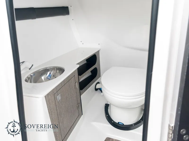 Slide: The Image of 2024 Monterey 275 Super Sport yacht bathroom with sink and toilet. - 12