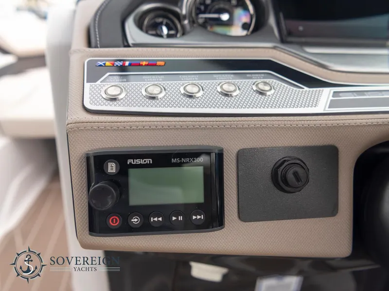 Slide: The Image of Control panel of the 2024 Monterey 275 Super Sport boat with Fusion MS-NRX300. - 16