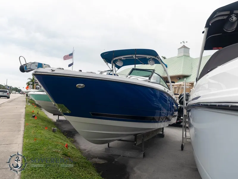 Slide: The Image of 2024 Monterey 275 Super Sport boat displayed outdoors. - 2