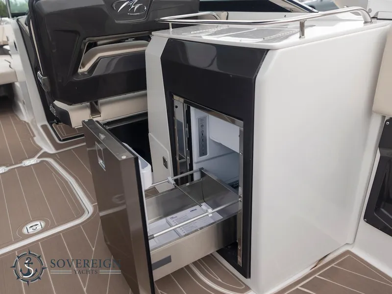 Slide: The Image of 2024 Monterey 275 Super Sport boat interior with open storage compartments. - 20