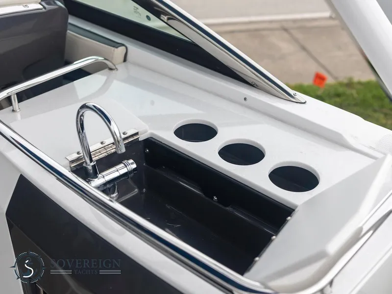 Slide: The Image of 2024 Monterey 275 Super Sport boat sink and cup holders. - 23