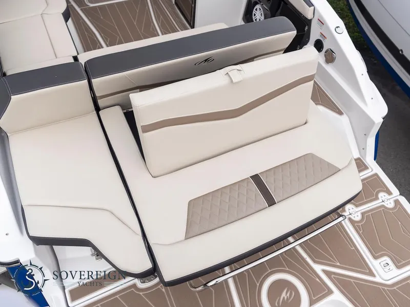 Slide: The Image of 2024 Monterey 275 Super Sport boat seating area with beige and brown upholstery. - 26