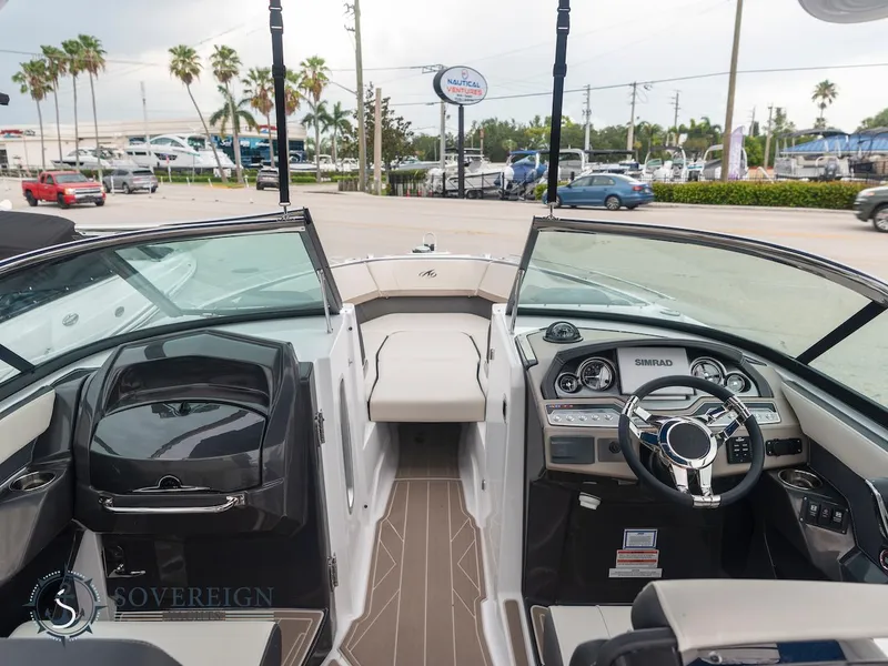 Slide: The Image of 2024 Monterey 275 Super Sport boat interior with dashboard and seating. - 5