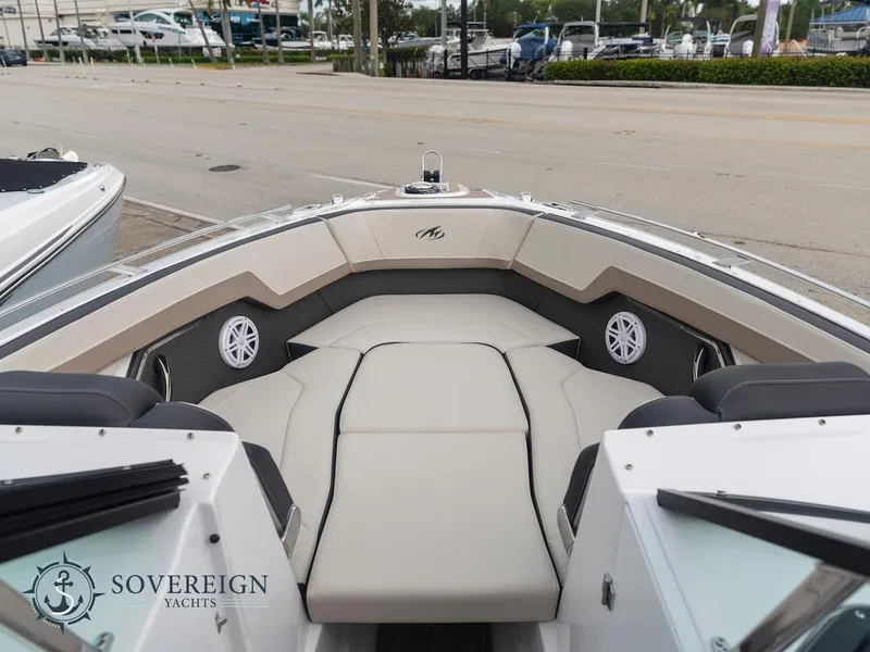 Slide: The Image of 2024 Monterey 275 Super Sport boat interior with cushioned seating and Sovereign Yachts logo. - 6