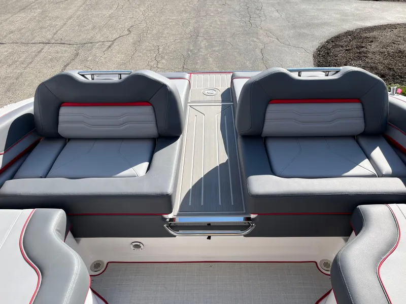 Slide: The Image of 2024 Regal LS9 boat with luxurious gray and red seating. - 10