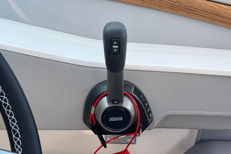 Slide: The Image of 2024 Regal LS9 boat throttle control with Volvo Penta branding. - 15