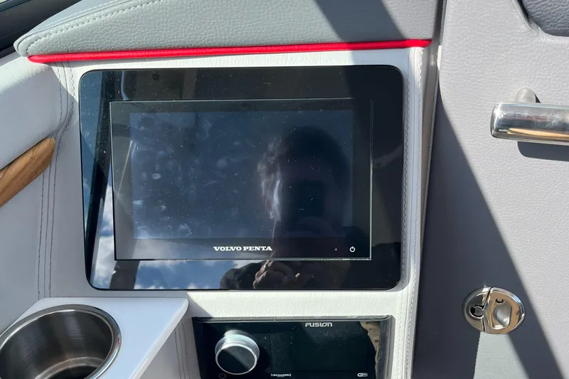 Slide: The Image of 2024 Regal LS9 dashboard with Volvo Penta display and Fusion audio system. - 17