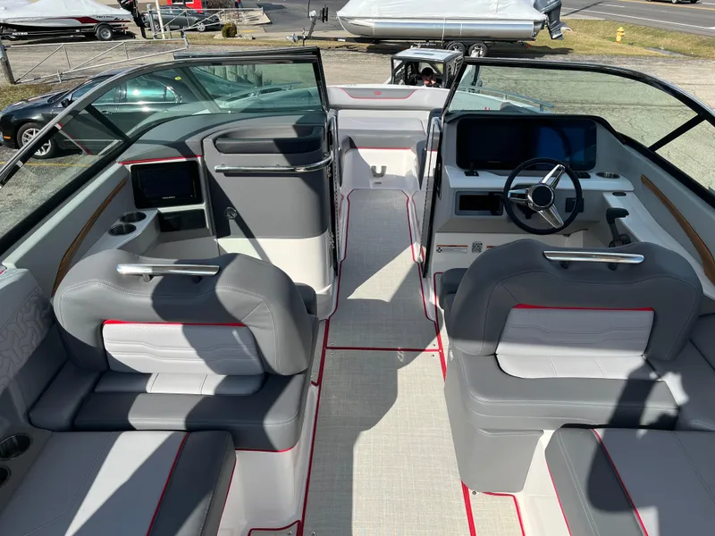 Slide: The Image of 2024 Regal LS9 boat interior with modern seating and advanced dashboard. - 3