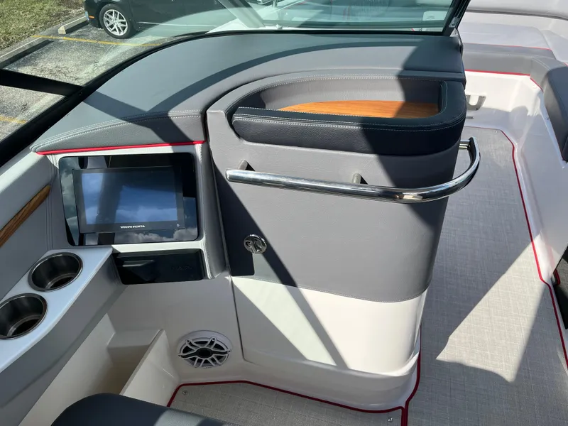 Slide: The Image of 2024 Regal LS9 boat interior with touchscreen display and cup holders. - 6