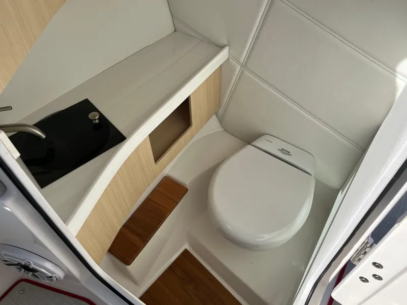Slide: The Image of 2024 Regal LS9 boat bathroom with modern sink and toilet. - 7