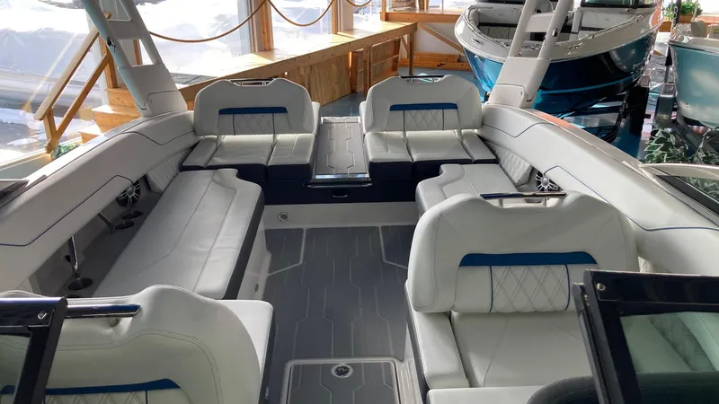 Slide: The Image of 2024 Regal LS6 boat interior with luxurious white seating and modern design. - 4