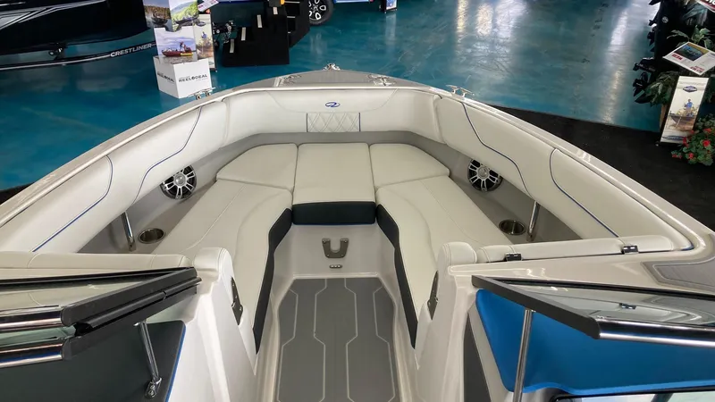 Slide: The Image of 2024 Regal LS6 boat interior with cushioned seating and built-in speakers. - 9