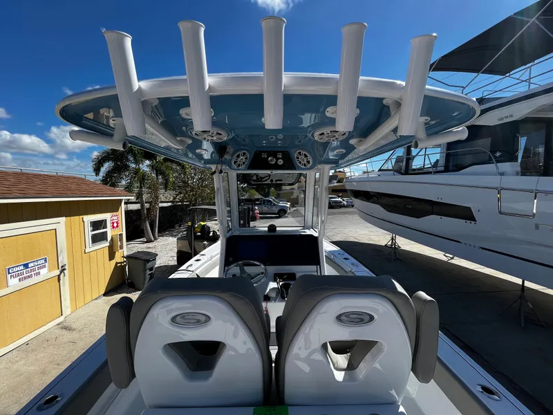 Slide: The Image of 2024 Sportsman Masters 267OE Bay Boat with dual seats and rod holders. - 11