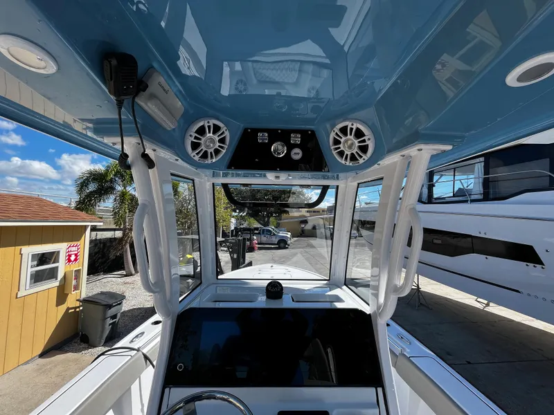 Slide: The Image of 2024 Sportsman Masters 267OE Bay Boat console with electronics and speakers. - 12