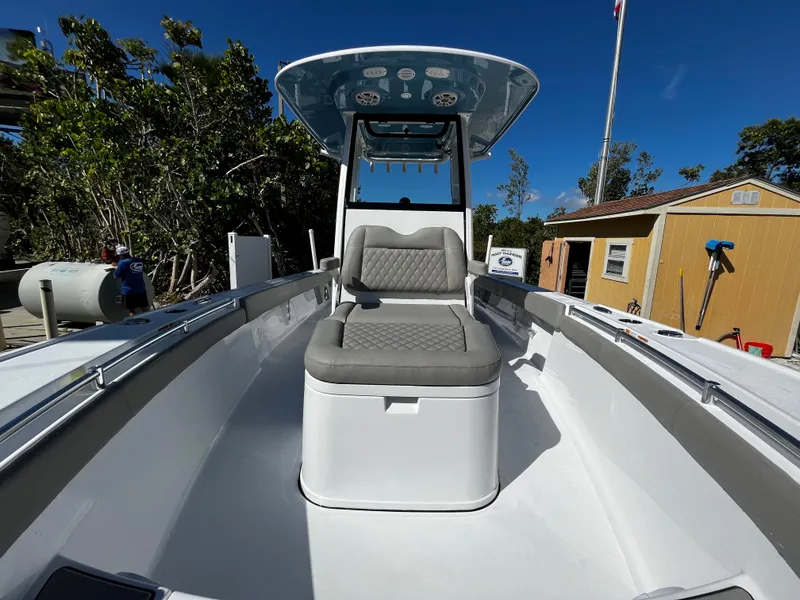 Slide: The Image of 2024 Sportsman Masters 267OE Bay Boat with cushioned seating and T-top. - 16