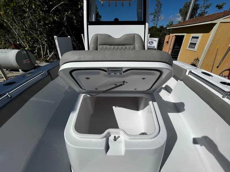 Slide: The Image of 2024 Sportsman Masters 267OE Bay Boat with open storage compartment. - 17