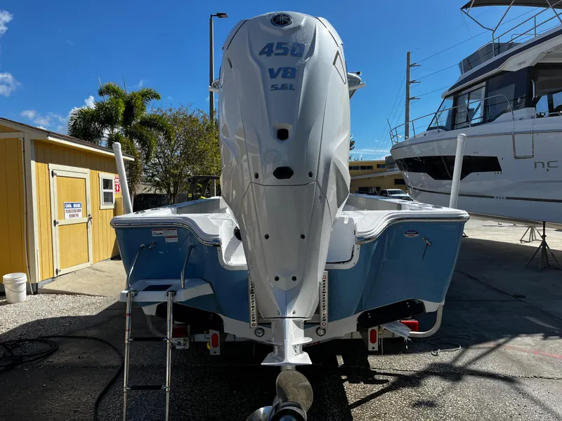 Slide: The Image of 2024 Sportsman Masters 267OE Bay Boat with 450 V8 engine, rear view. - 4