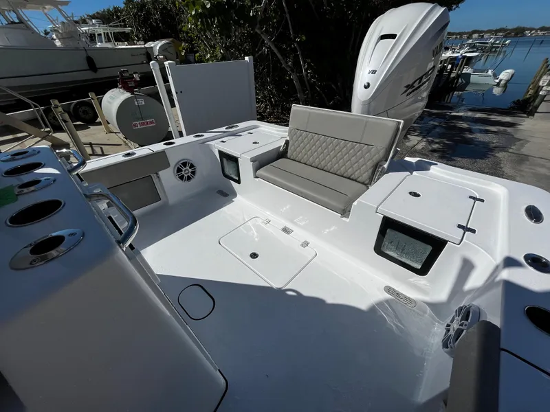 Slide: The Image of 2024 Sportsman Masters 267OE Bay Boat with seating and storage compartments. - 6