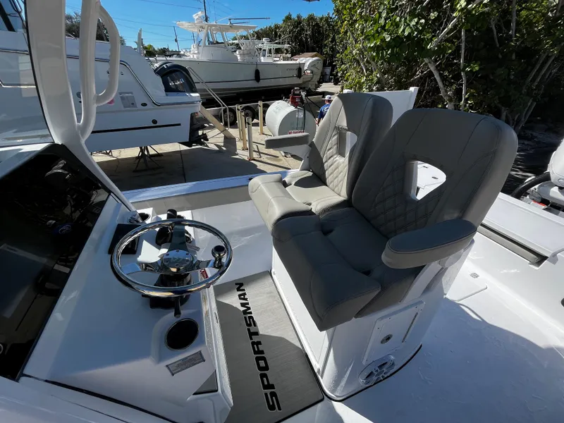 Slide: The Image of 2024 Sportsman Masters 267OE Bay Boat helm with dual seats and steering wheel. - 9