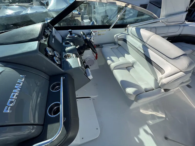 Slide: The Image of 2014 Formula 350 Crossover Bowrider cockpit with luxurious seating and modern controls. - 12