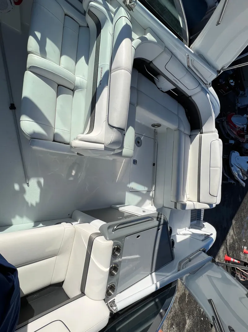 Slide: The Image of 2014 Formula 350 Crossover Bowrider interior with white leather seating. - 14