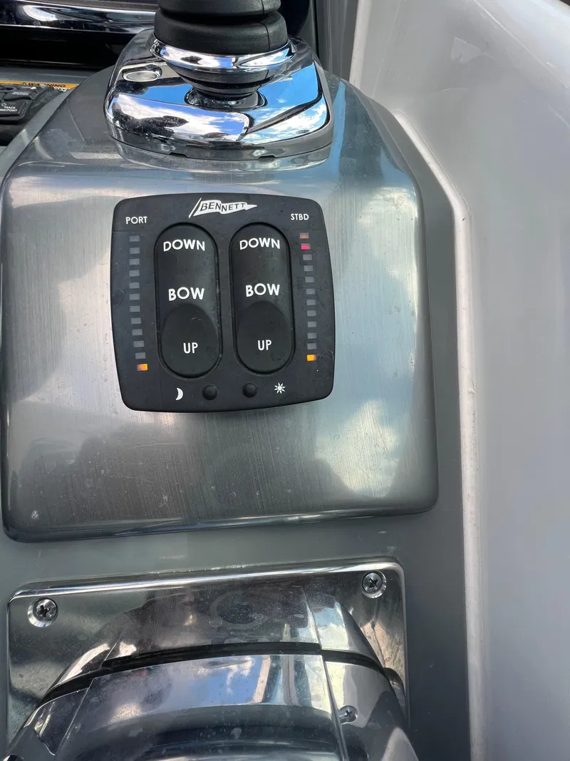 Slide: The Image of 2014 Formula 350 Crossover Bowrider control panel with trim tab switches. - 15