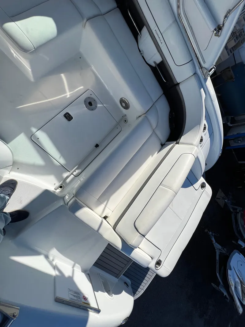 Slide: The Image of 2014 Formula 350 Crossover Bowrider interior seating and deck area. - 16