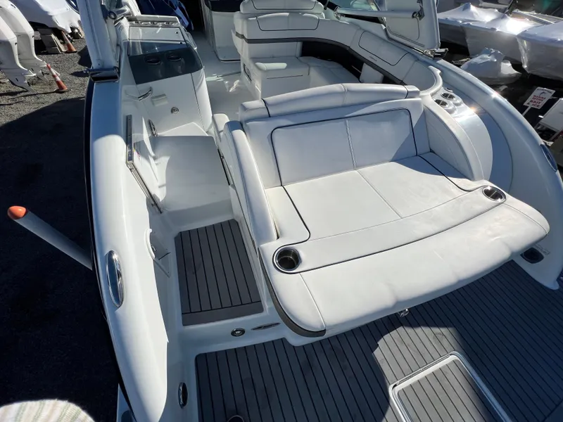Slide: The Image of 2014 Formula 350 Crossover Bowrider interior with white seating and gray flooring. - 18
