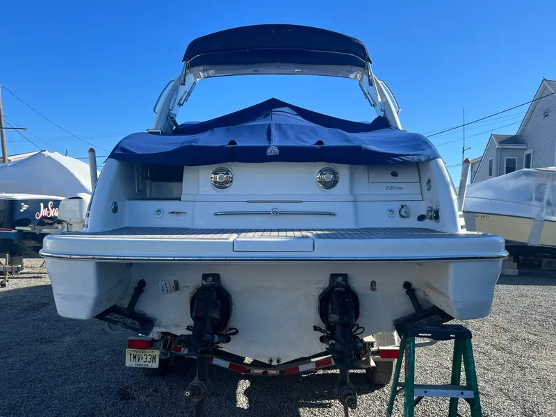 Slide: The Image of 2014 Formula 350 Crossover Bowrider boat, rear view, on trailer. - 2