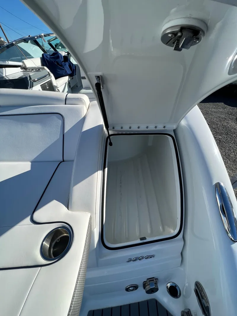 Slide: The Image of 2014 Formula 350 Crossover Bowrider storage compartment open on deck. - 20