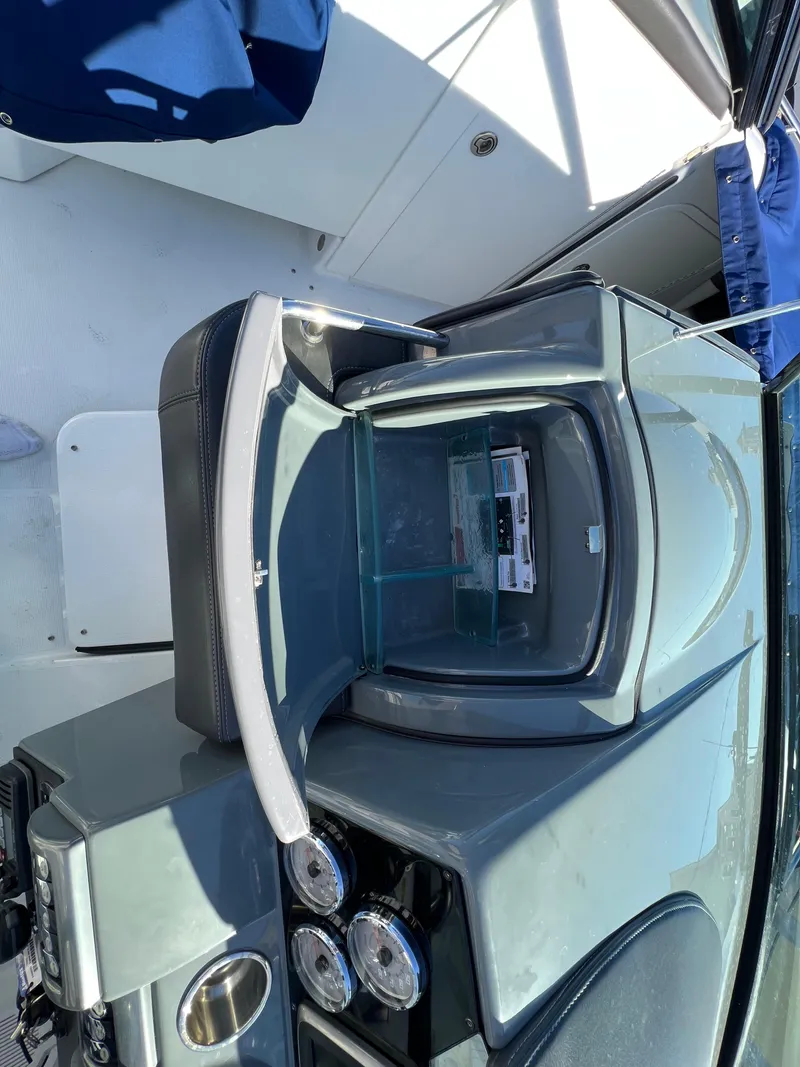 Slide: The Image of 2014 Formula 350 Crossover Bowrider dashboard with open glove compartment. - 22