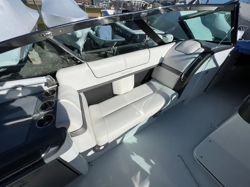 Slide: The Image of 2014 Formula 350 Crossover Bowrider interior seating area with white upholstery. - 24