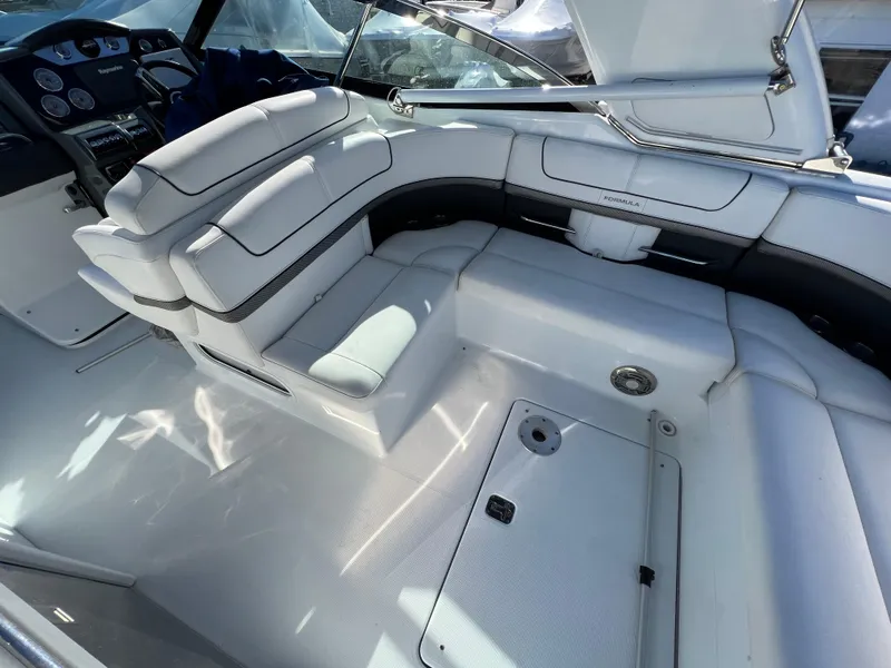 Slide: The Image of 2014 Formula 350 Crossover Bowrider interior with white leather seating and dashboard. - 29