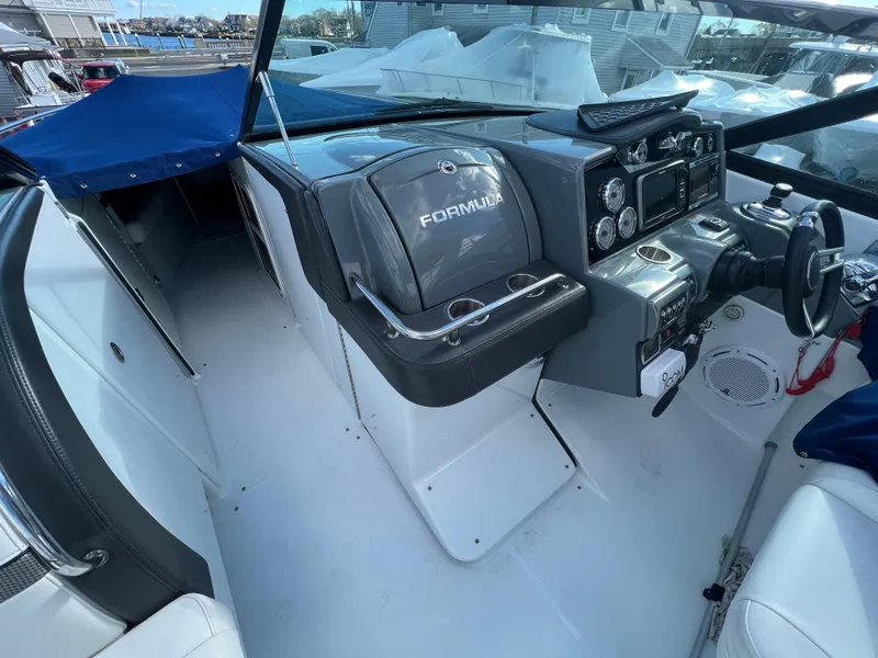 Slide: The Image of 2014 Formula 350 Crossover Bowrider cockpit with modern dashboard and seating. - 35