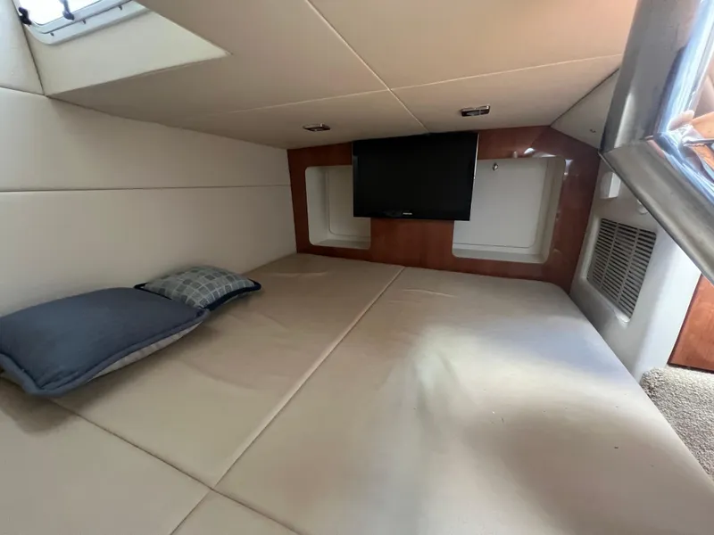 Slide: The Image of 2014 Formula 350 Crossover Bowrider cabin interior with bed and TV - 38