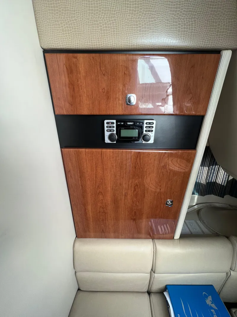 Slide: The Image of Interior of a 2014 Formula 350 Crossover Bowrider with wood paneling and control panel. - 40