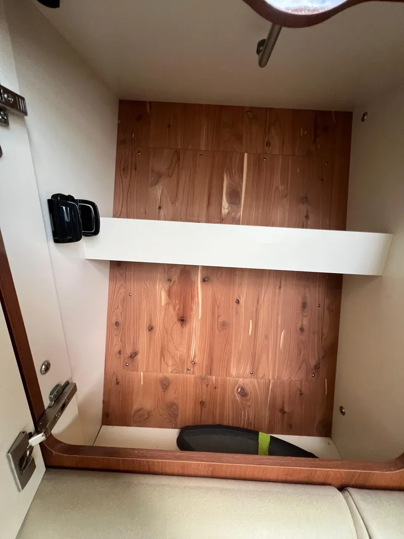 Slide: The Image of Interior storage compartment of a 2014 Formula 350 Crossover Bowrider boat. - 42