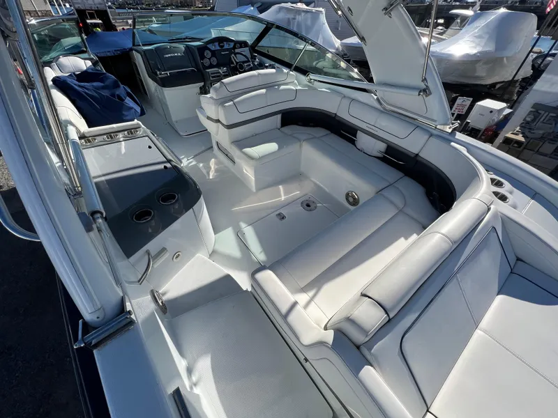 Slide: The Image of 2014 Formula 350 Crossover Bowrider interior with white seating and helm. - 6