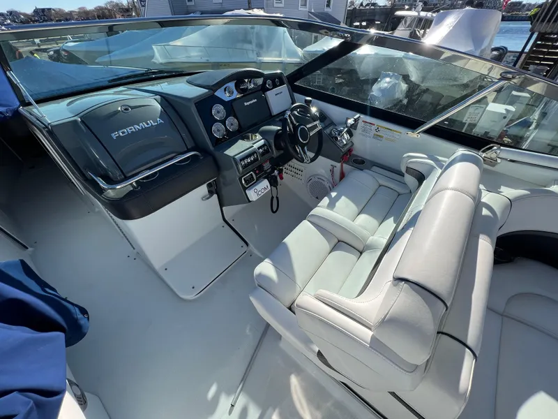 Slide: The Image of 2014 Formula 350 Crossover Bowrider cockpit with steering wheel and control panel. - 7