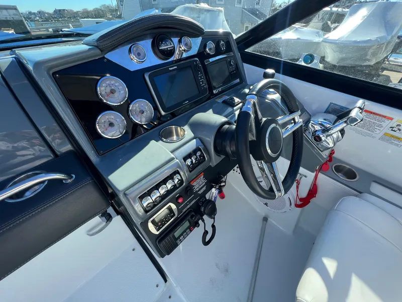Slide: The Image of 2014 Formula 350 Crossover Bowrider dashboard with steering wheel and control panel. - 8
