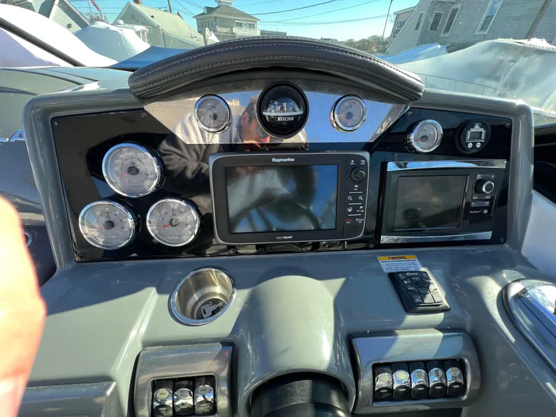 Slide: The Image of Dashboard of a 2014 Formula 350 Crossover Bowrider with navigation and control instruments. - 9